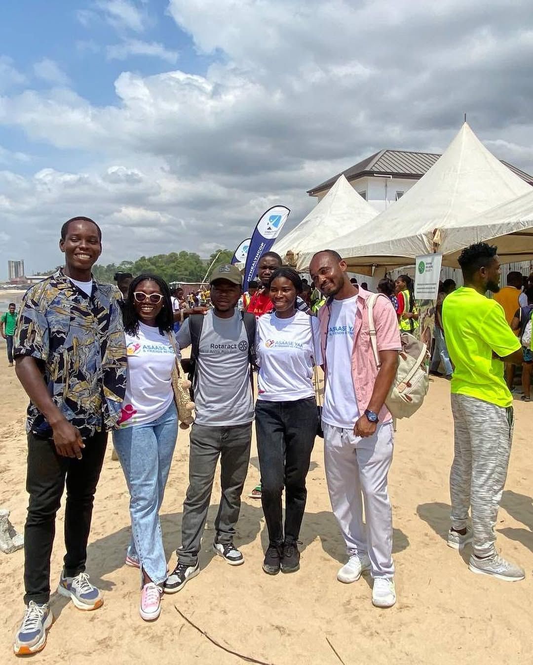 Clean-up team posing on the beach